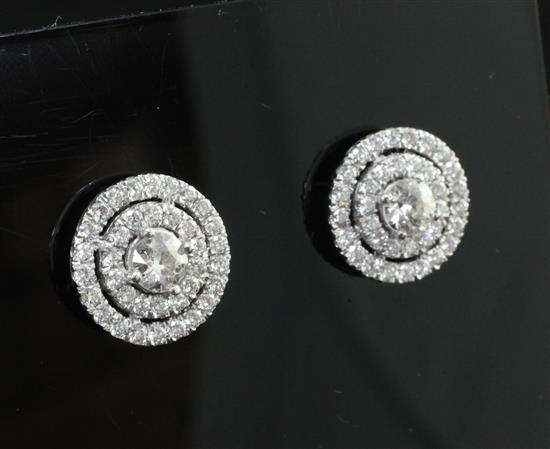 A pair of white gold and diamond cluster target ear studs, approx. 0.5in.